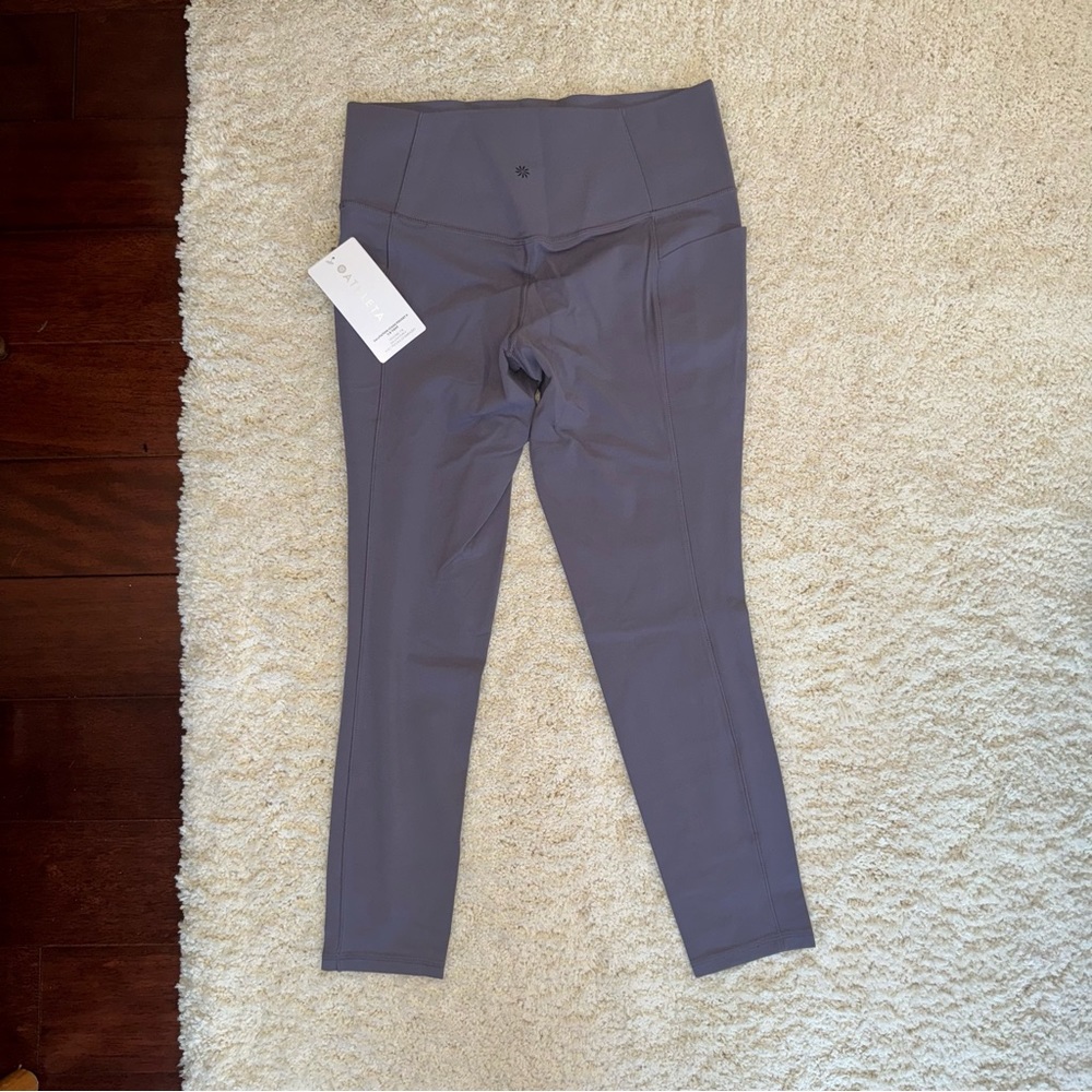 NWT - Athleta Salutation Stash Pocket II 7/8 tights - never worn Size L purple